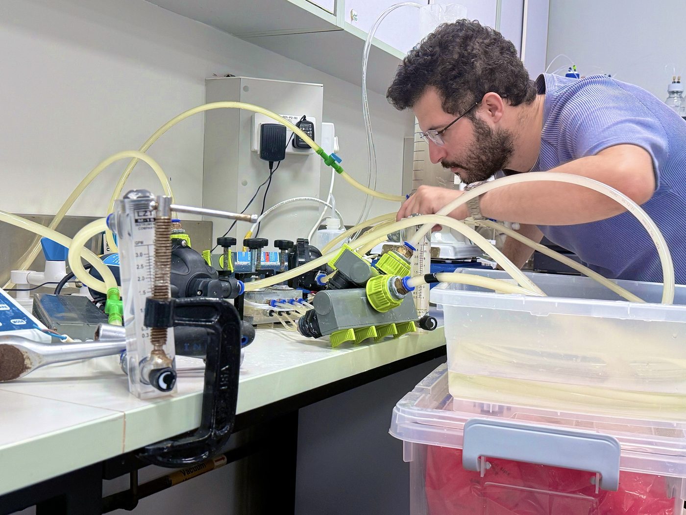 Working on a membrane test rig in the lab